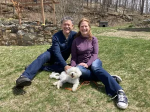 Monica with her husband and one of her dogs